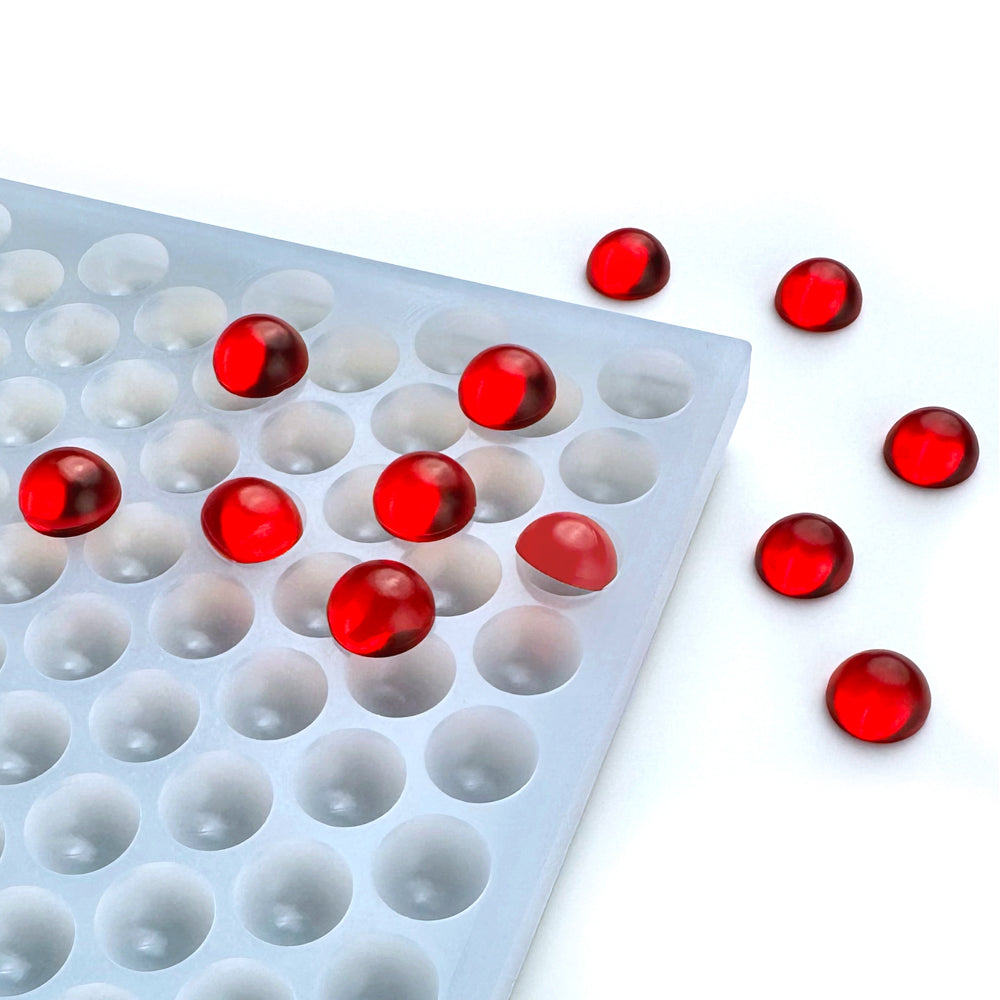 Custom food-grade silicone bon bon gummy mold, 0.5ml round dome cavities designed for hand pouring and scraping, shown with red gummies.