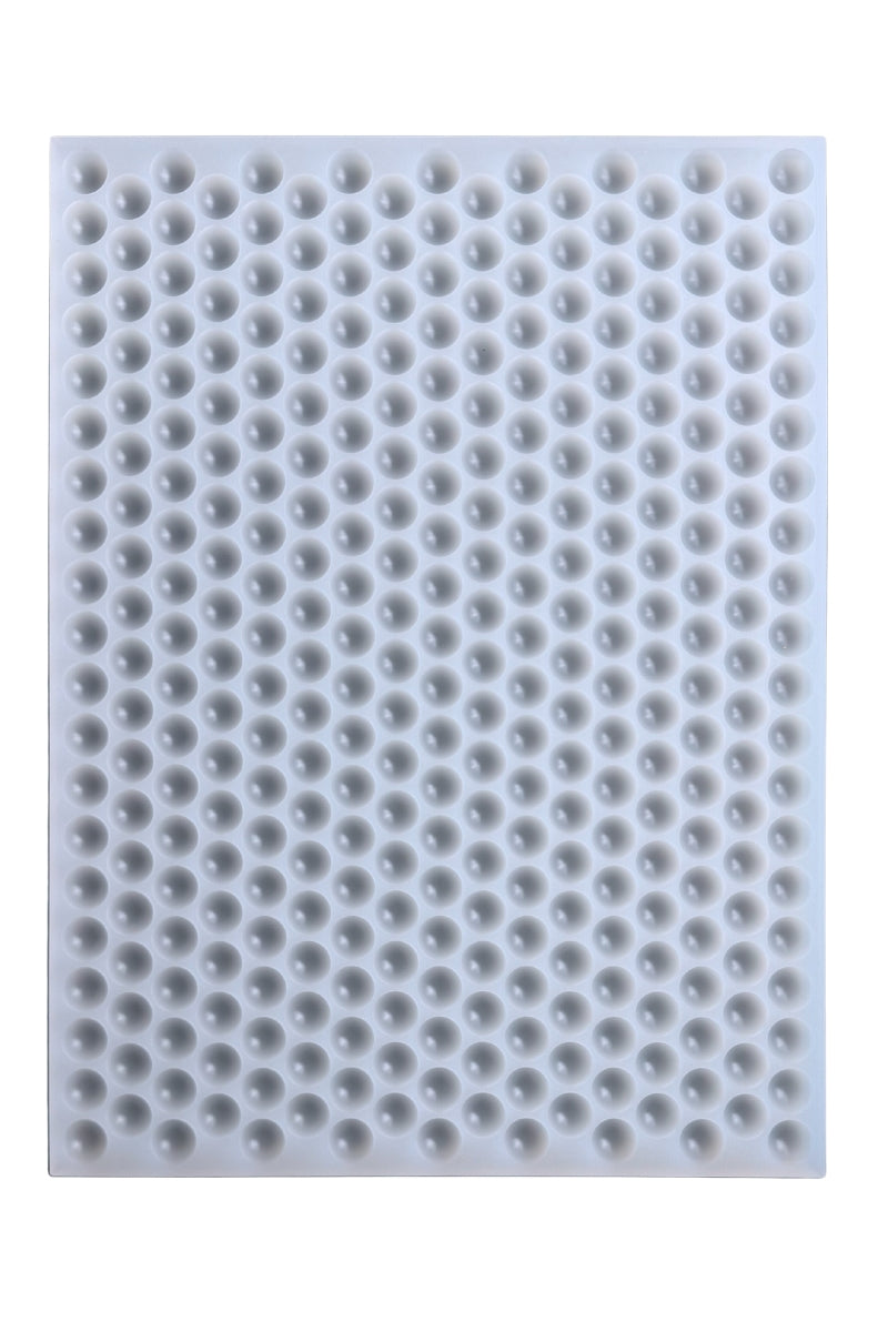 Platinum silicone mold with multiple round 1.5ml bon bon cavities, designed for precision candy, gummy, and chocolate making.