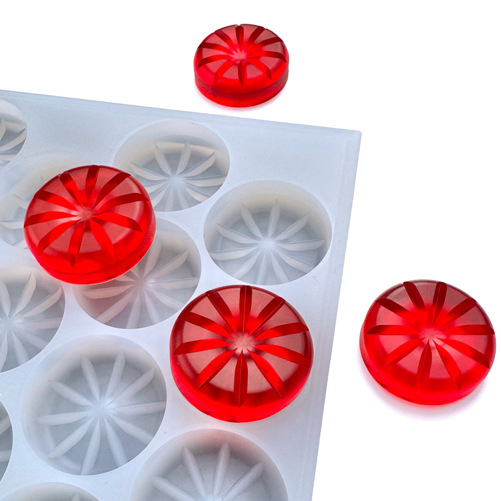 A BPA-free, white Vector Molds 13 mL Pie Multidose Gummy Mold (half sheet, 72 cavities) with circular shapes is shown beside three red, round gummies featuring a starburst pattern.