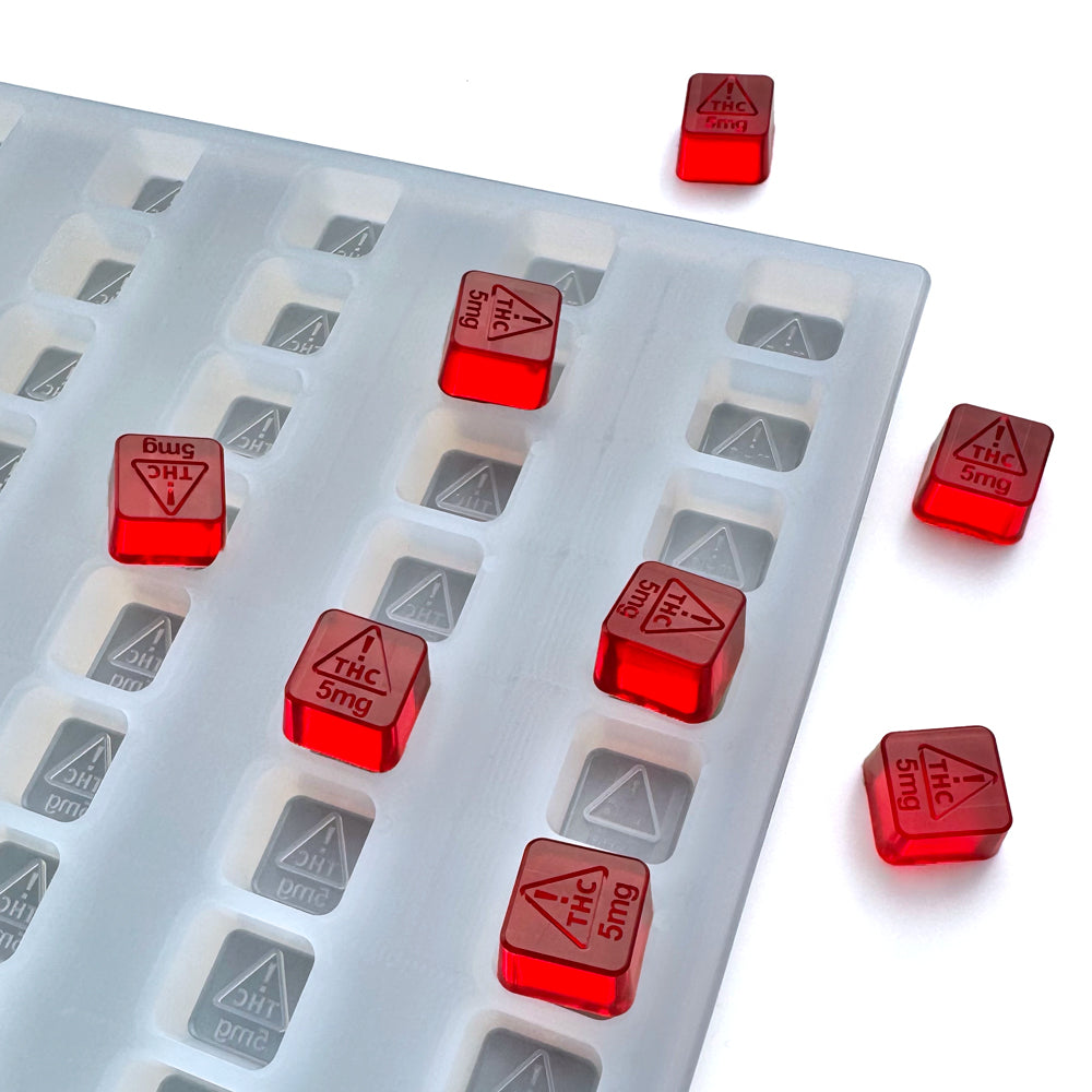 Food-grade silicone gummy mold, 2ml square cavities with NV & MI-compliant logo design 5mg, red gummies shown, universal depositor compatible.