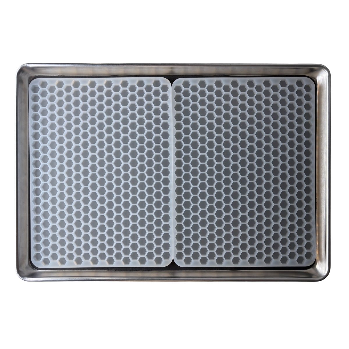 A Vector Molds 2 mL Hexagon Gummy Mold - Half Sheet with 331 cavities, featuring two food-grade silicone mats with a honeycomb pattern, fits side by side on a metal baking sheet.