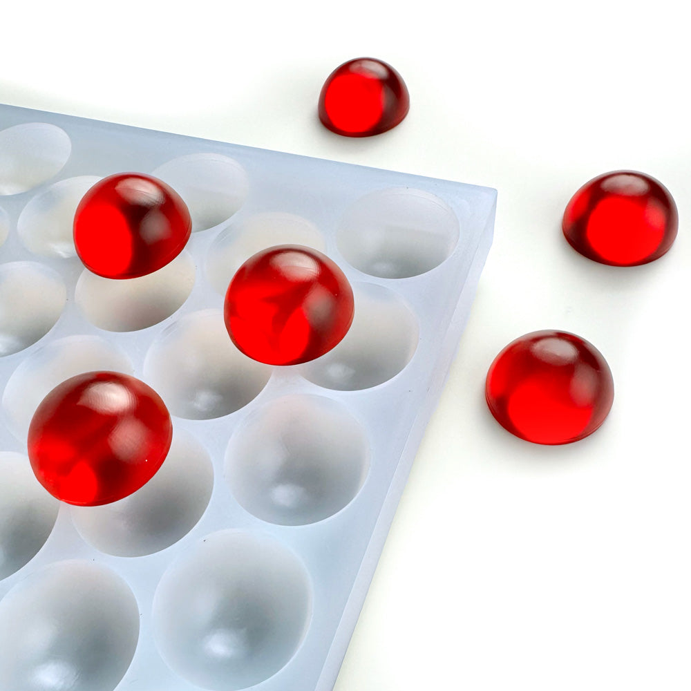 Custom food-grade silicone bon bon gummy mold, 6ml smooth round dome cavities, shown with red gummies, compatible for flood & scrape, hand pour.