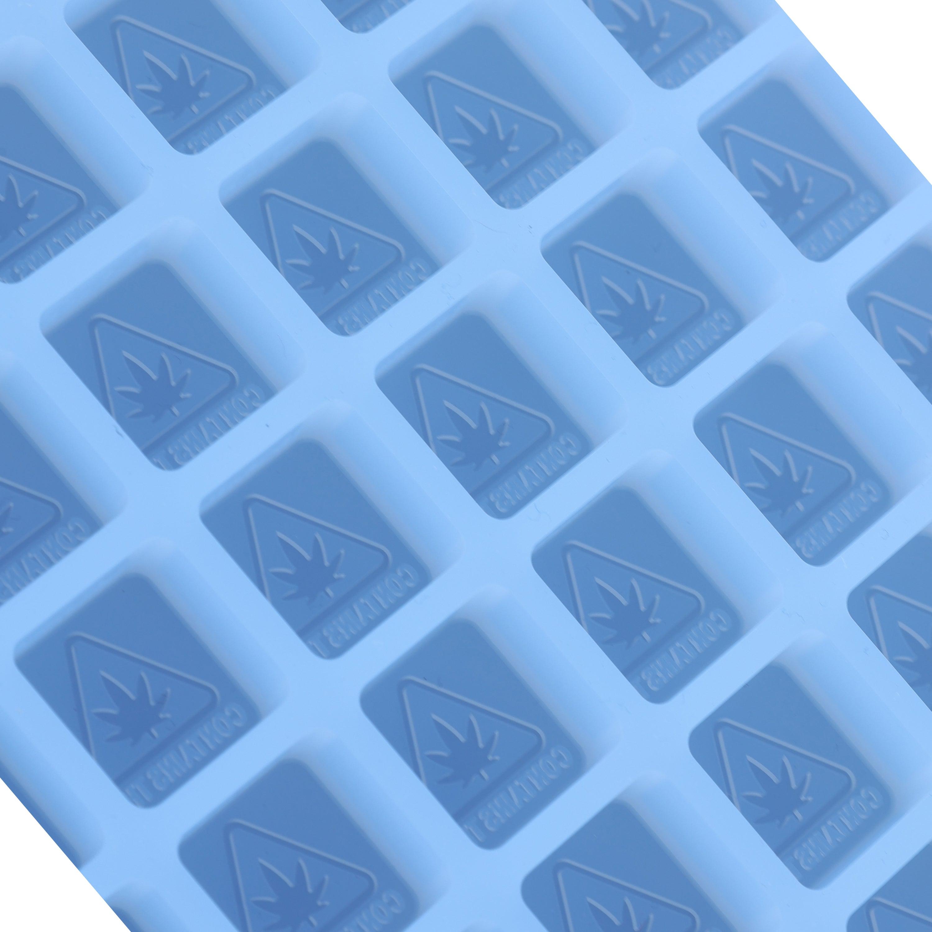 A blue silicone mold tray with rectangular cavities, each marked with a cannabis leaf symbol and the word "CAUTION.