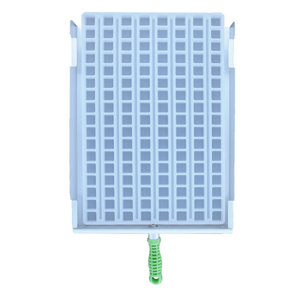 Rectangular ice cube tray with a grid of square molds and a green handle attached at the bottom center, viewed from above.