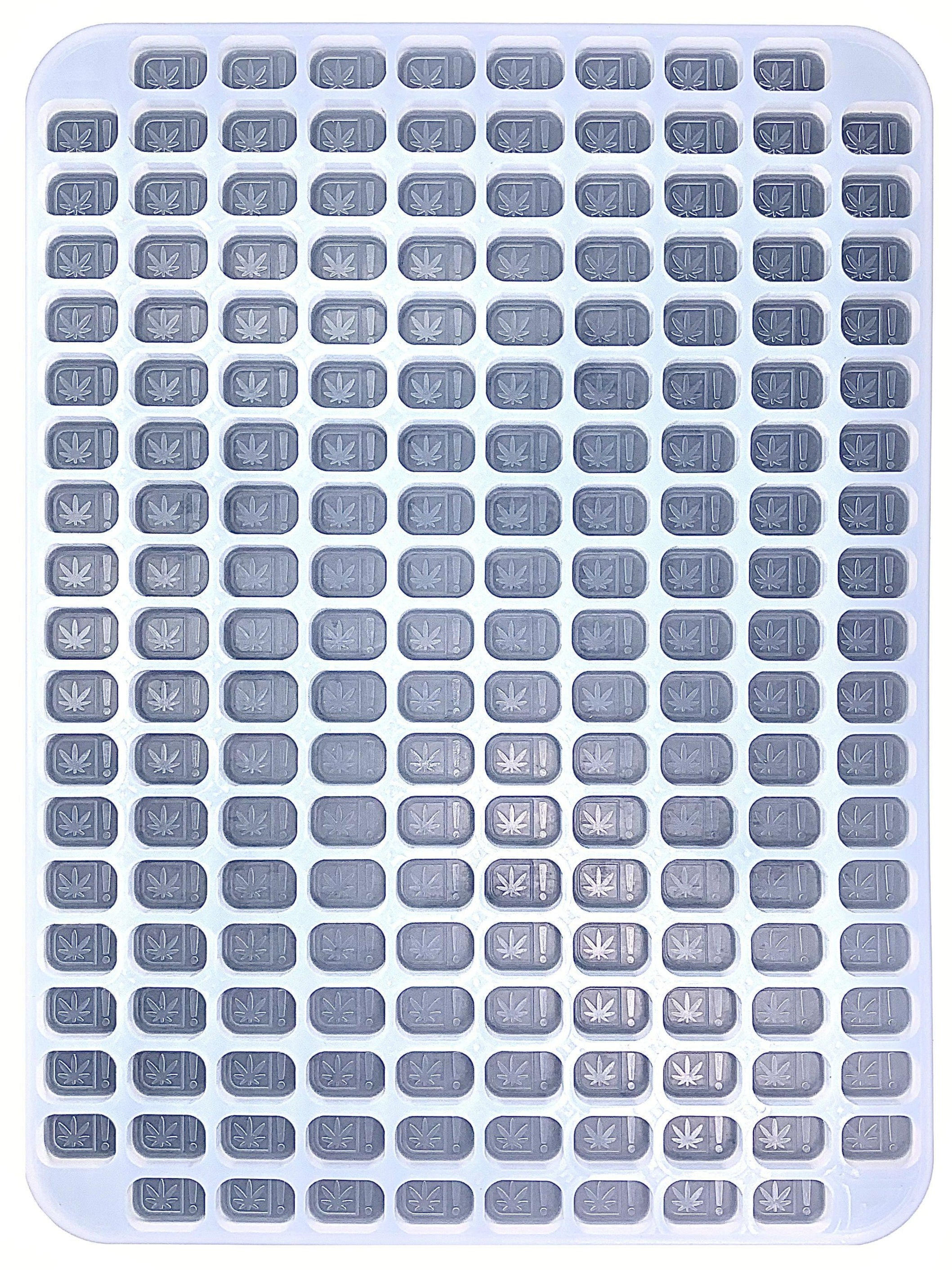overhead view of 4 mL Oklahoma and Oregon State Compliance symbol Rounded Brick Silicone Mold. Perfect for hand pouring or flood and scrape gummy manufacturing. Precision made for precise dosing. Food grade and oven/dishwasher safe molds.