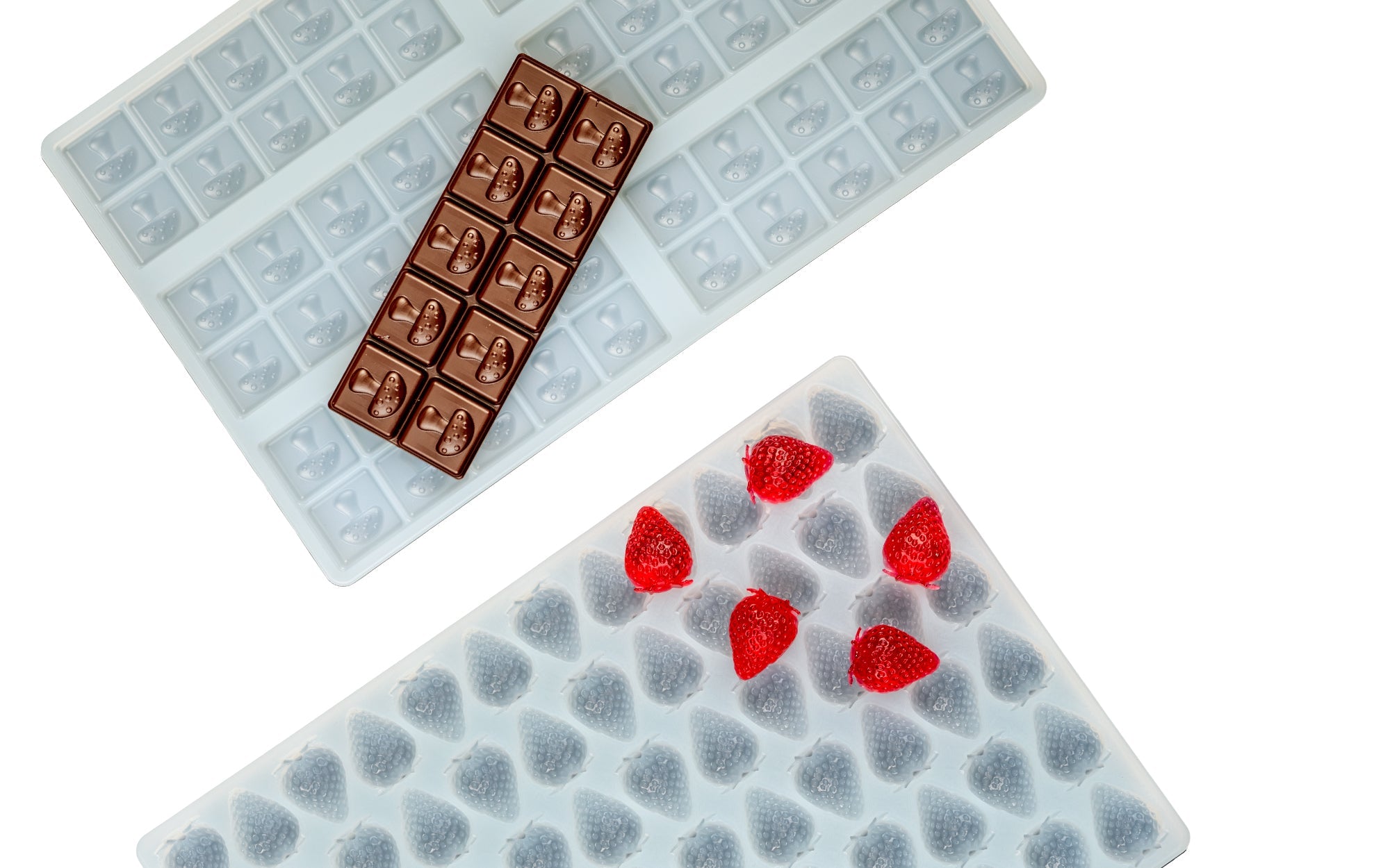 Two silicone ice cube trays with different grid patterns, each holding a chocolate bar, on a white background.