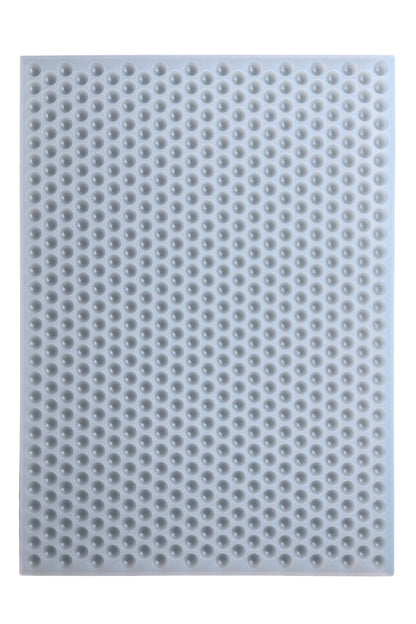 Platinum silicone mold with multiple round 0.5ml bon bon cavities, designed for candy, gummy, & chocolate. 