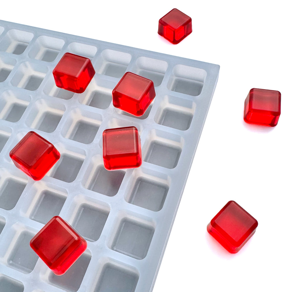 Custom food-grade silicone square gummy mold, 2ml cavities with sharp edges and clean finish, shown with red gummies, for flood & scrape, hand pour.