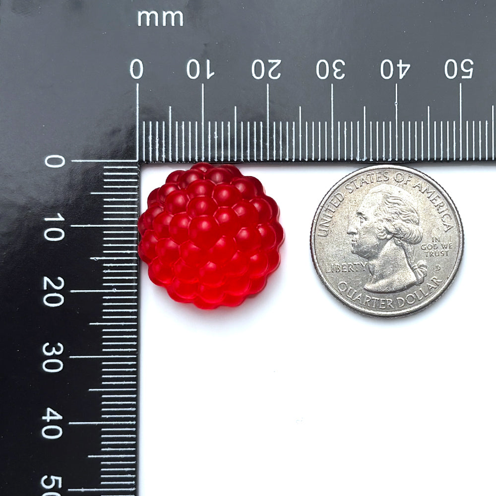3ml Raspberry Gummy next to a Quarter for size comparison, with a millimeter ruler for measurements 