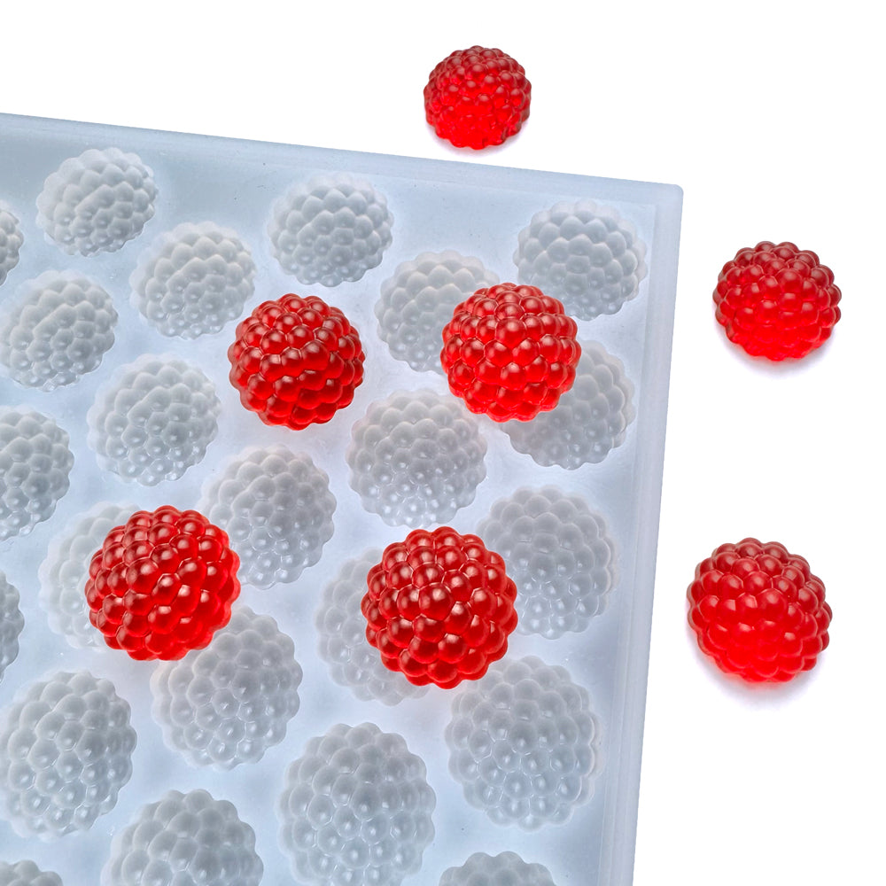 Custom food-grade silicone Raspberry gummy mold, 3ml cavities designed for clean demolding. Perfect for flood and scrape and shown with red gummies.