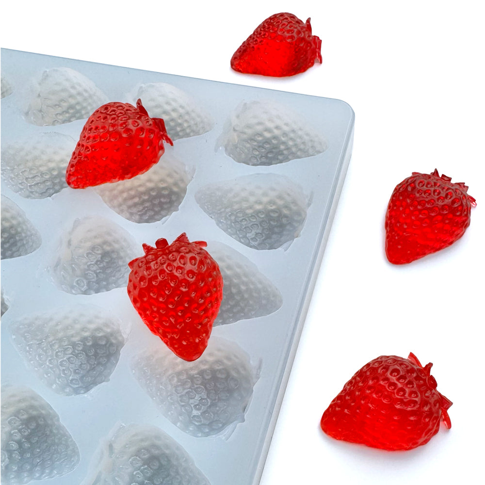 Quarter sheet food-grade silicone mold featuring realistic 4 mL strawberry-shaped cavities, shown with glossy red gummies, ideal for candy and supplement production.