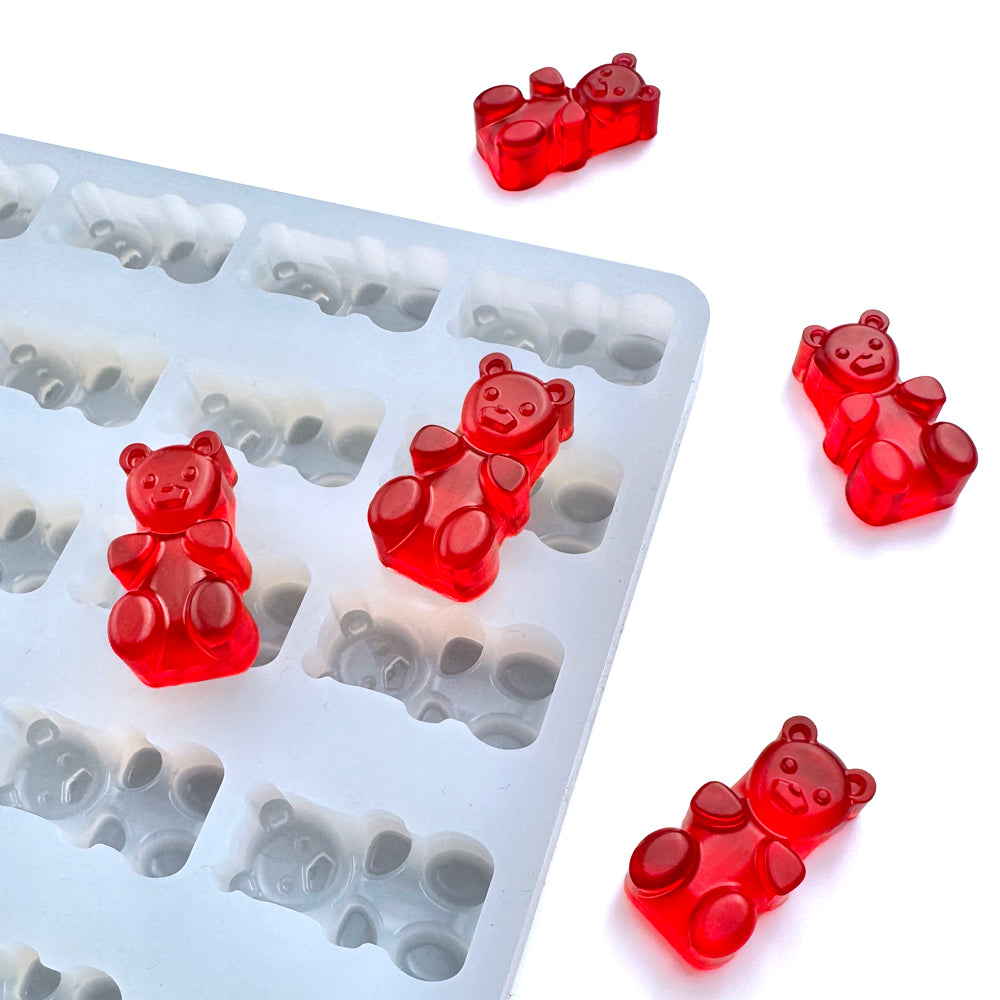 Custom food-grade silicone gummy bear mold, 4ml cavities with detailed bear design, shown with red gummies, compatible with universal depositor machines.
