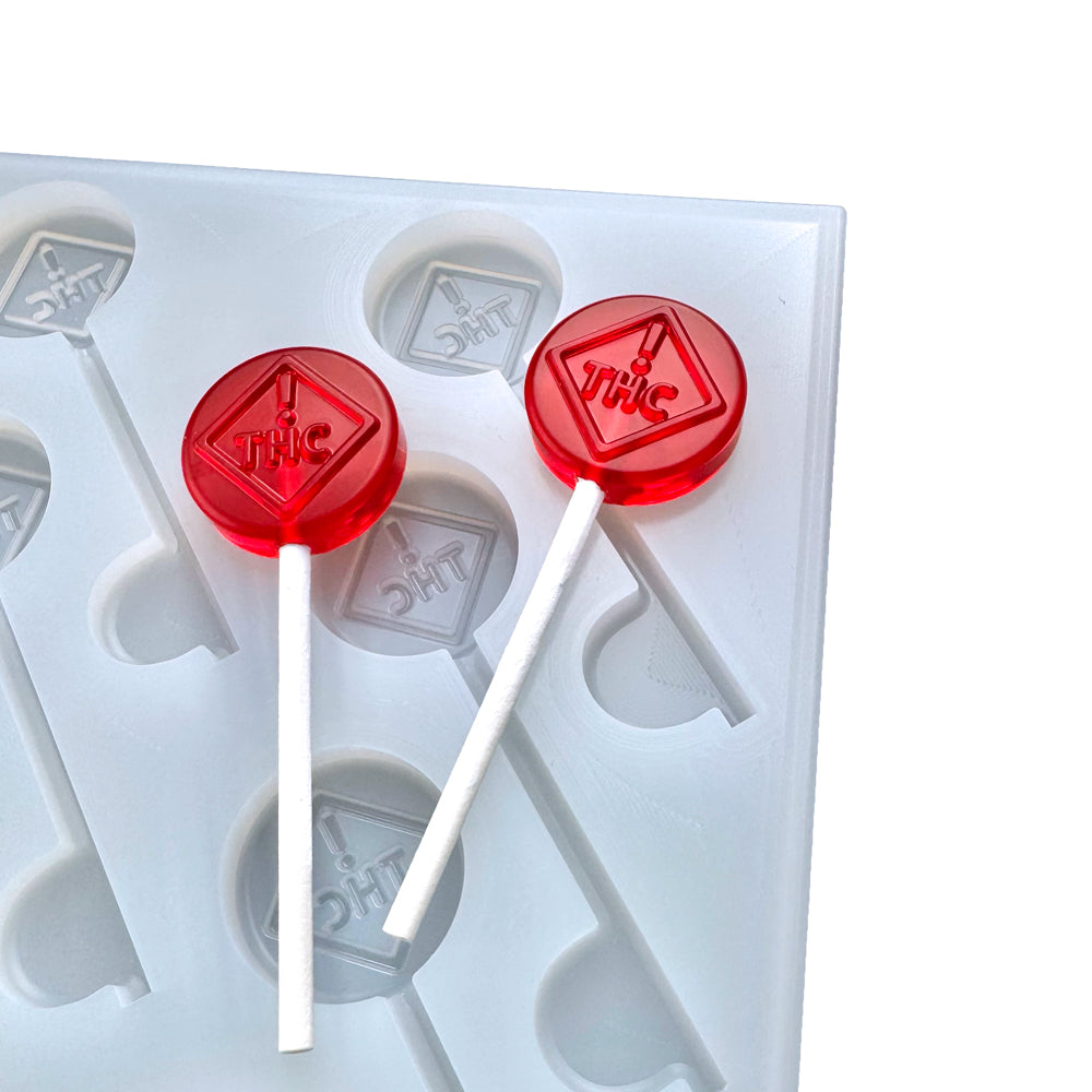 Custom food-grade silicone Sucker mold, 6ml cavities with CO, OH, NM, & FL-compliant logo design, shown with red suckers, compatible with universal depositor machines.