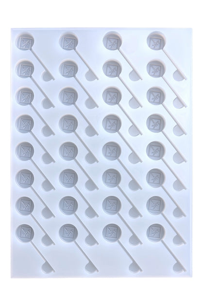 The Vector Molds 6mL CO/OH/NM/FL Sucker-Depositor features 32 hexagonal cavities on sticks, arranged diagonally. Made from professional, food-grade, BPA-free silicone for safe and easy candy crafting.