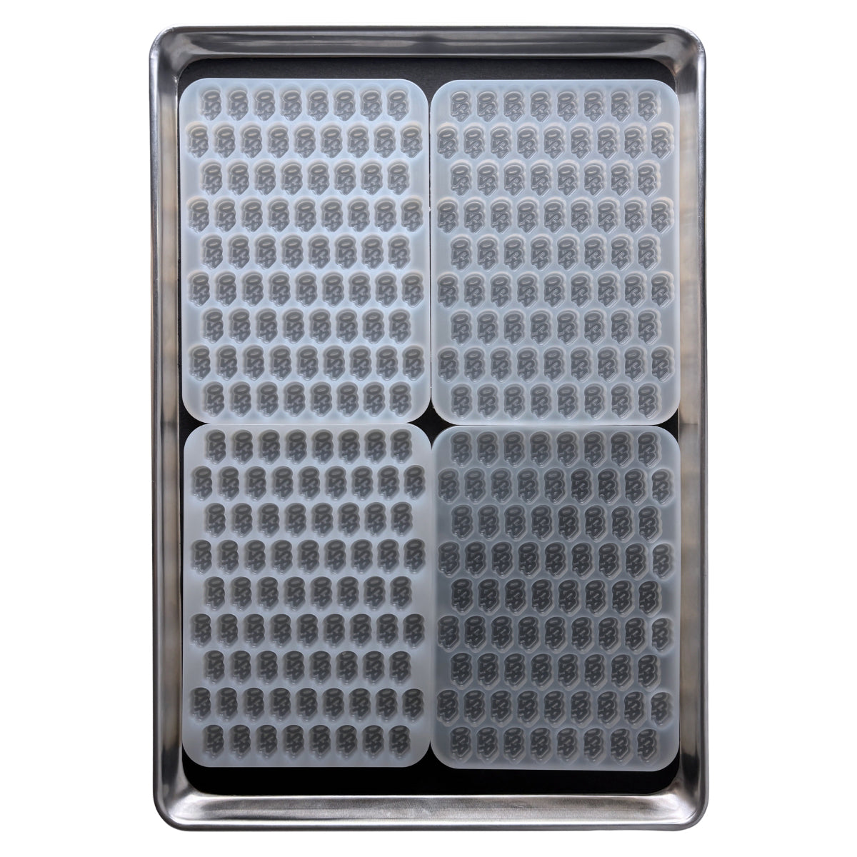 Standard industrial baking pan holding four quarter sheet custom gummy molds, designed to maximize commercial manufacturing space. 