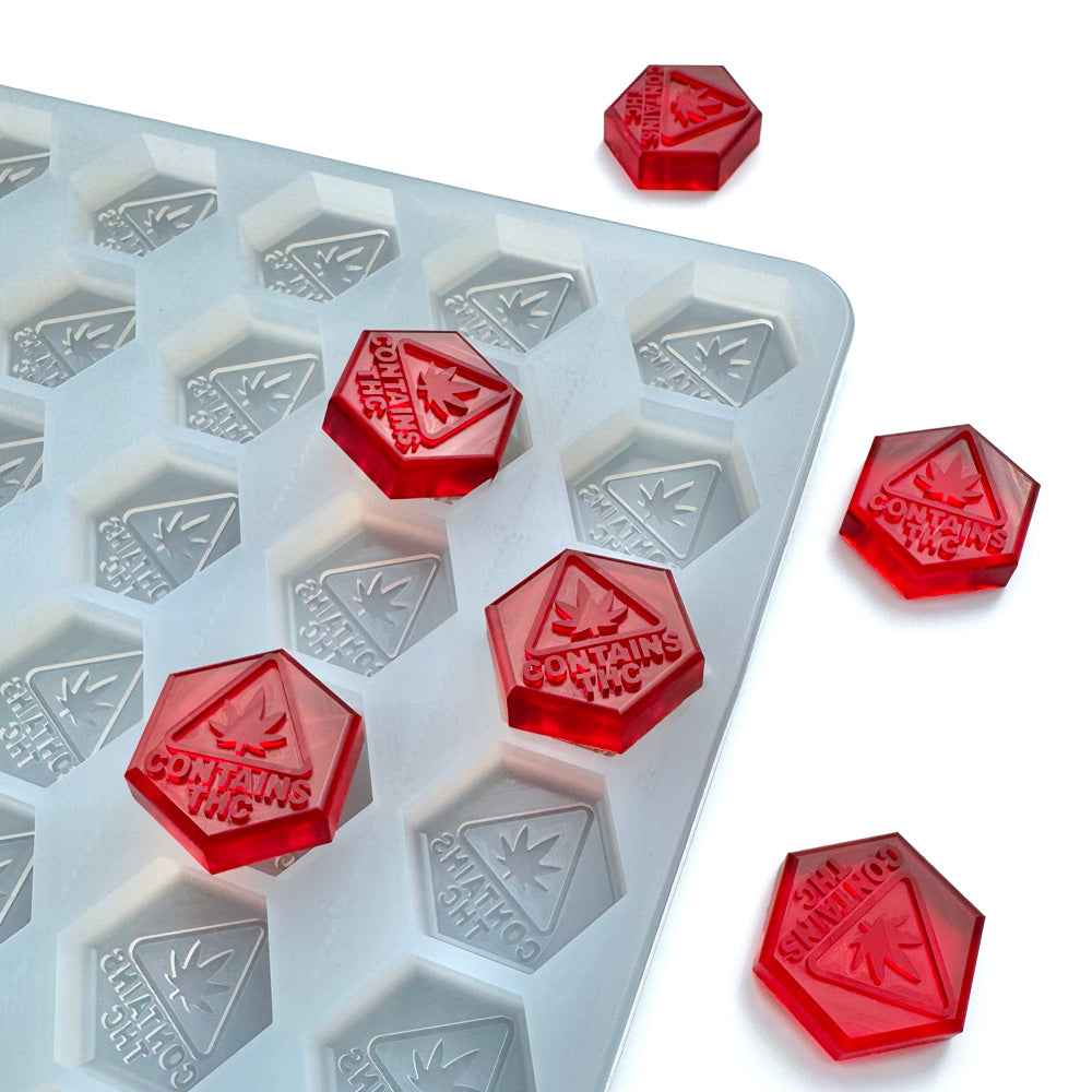The Vector Molds 4.6 mL Hexagon Gummy Mold features 112 hexagonal cavities with a THC logo, perfect for MA, ME & RI compliance and universal depositors—ideal for making precise, professional-grade gummies.